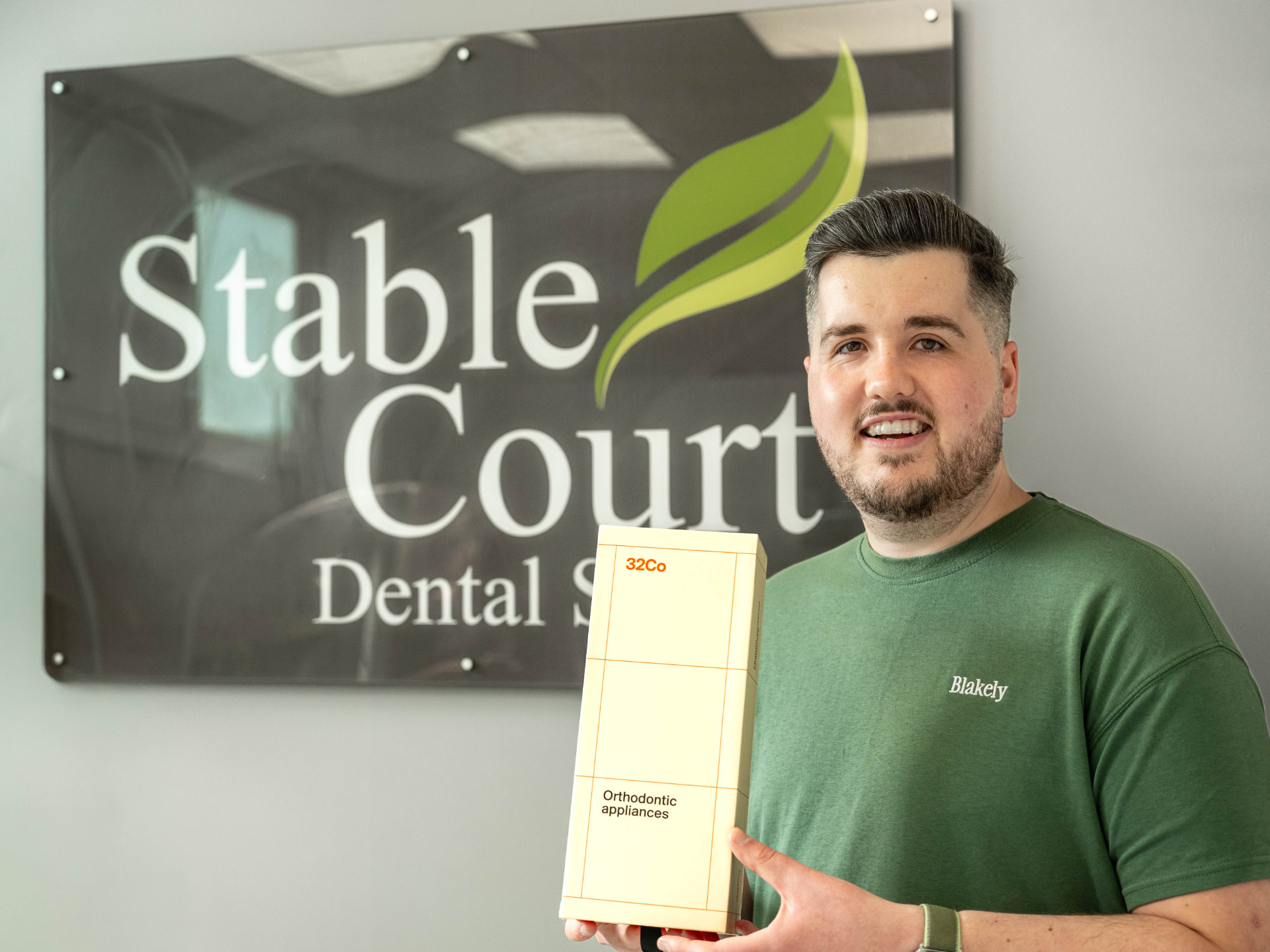 Stable Court team member with orthodontic aligners